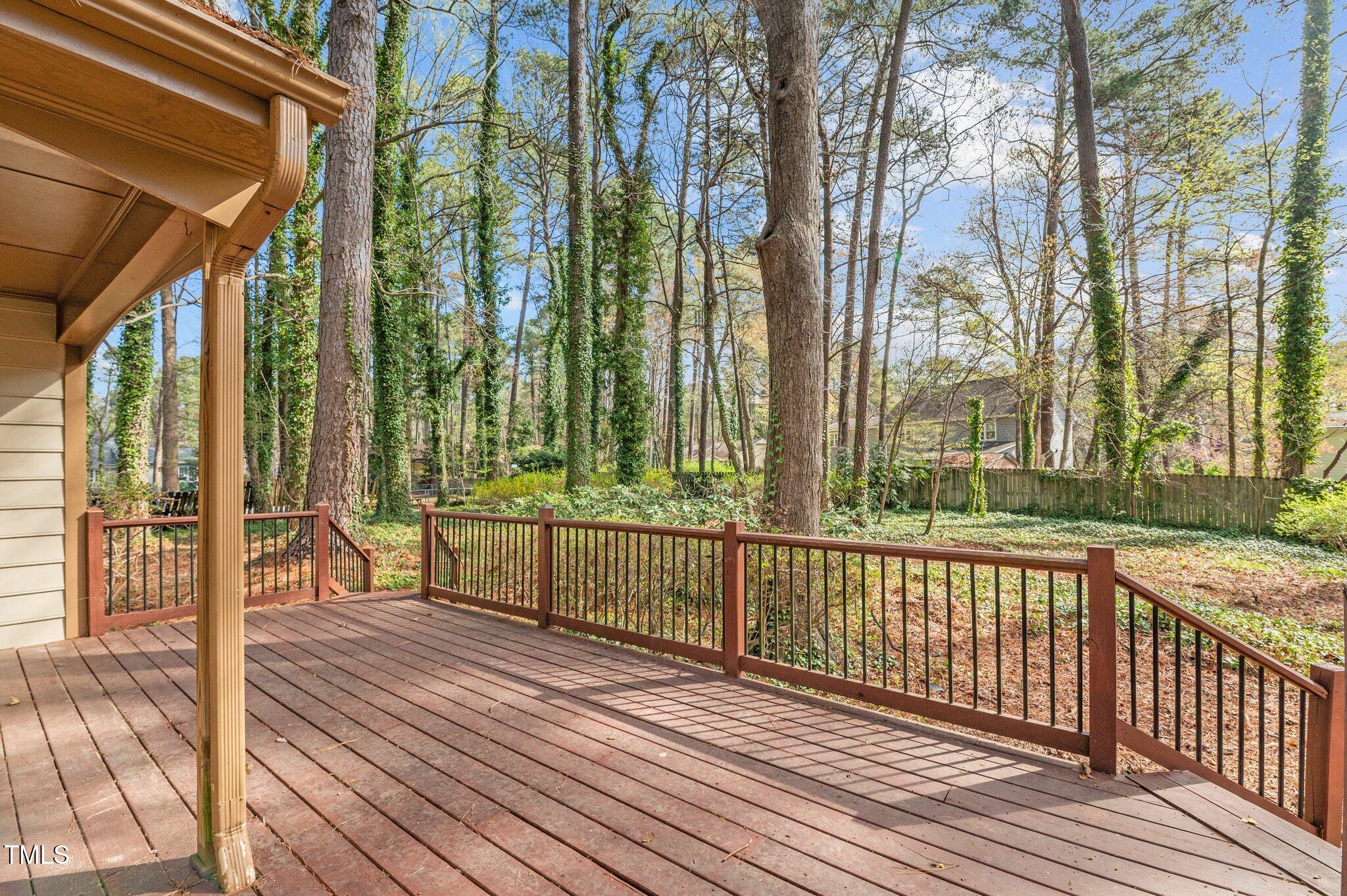 8404 Sleepy Creek Drive Raleigh, NC 27613 - Photo 35 of 39 a view of a room with wooden floor and fence