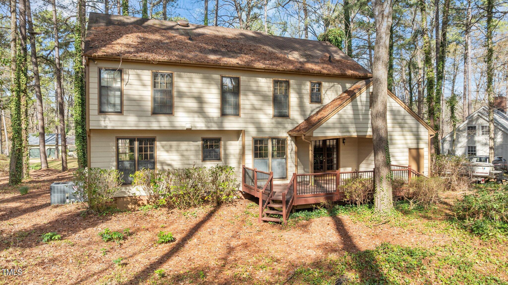 8404 Sleepy Creek Drive Raleigh, NC 27613 - Photo 38 of 39 a view of a house with a yard and sitting area