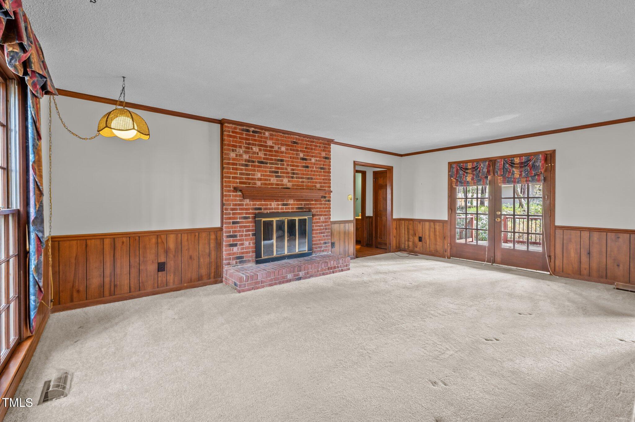 8404 Sleepy Creek Drive Raleigh, NC 27613 - Photo 5 of 39 an empty room with windows