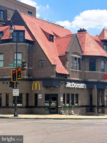 a view of field with trees in the background