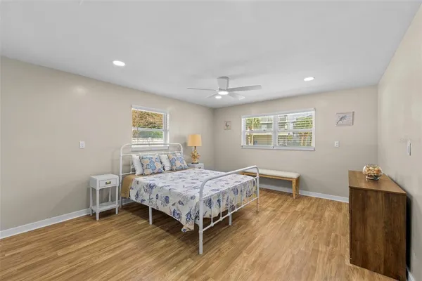 a bedroom with a bed and a desk