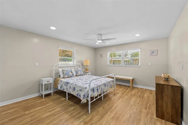 a bedroom with a bed and a desk