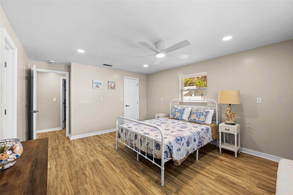 2506 Bay Boulevard Indian Rocks Beach, FL 33785 - Photo 13 of 36 a bedroom with a bed and a dresser