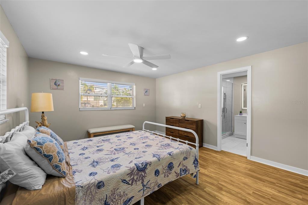 2506 Bay Boulevard Indian Rocks Beach, FL 33785 - Photo 14 of 36 a bedroom with a bed and a window