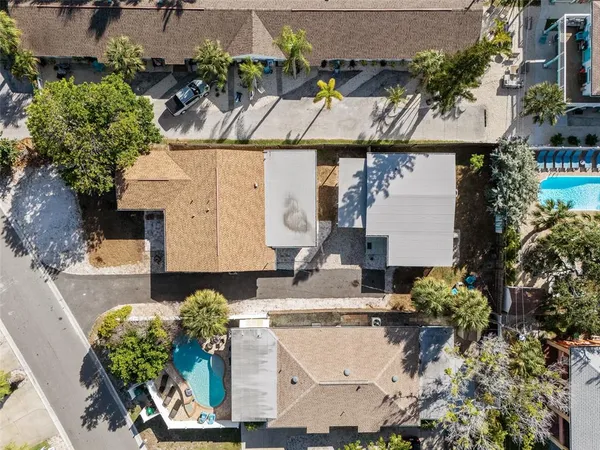 an aerial view of a house with outdoor space