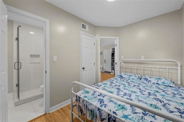 a bedroom with a bed and a dresser