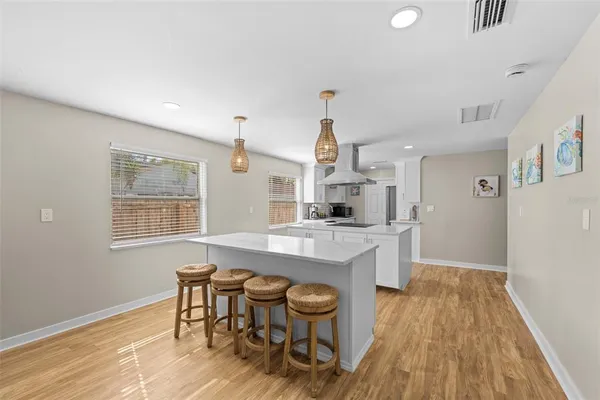 a kitchen with a table and chairs in it