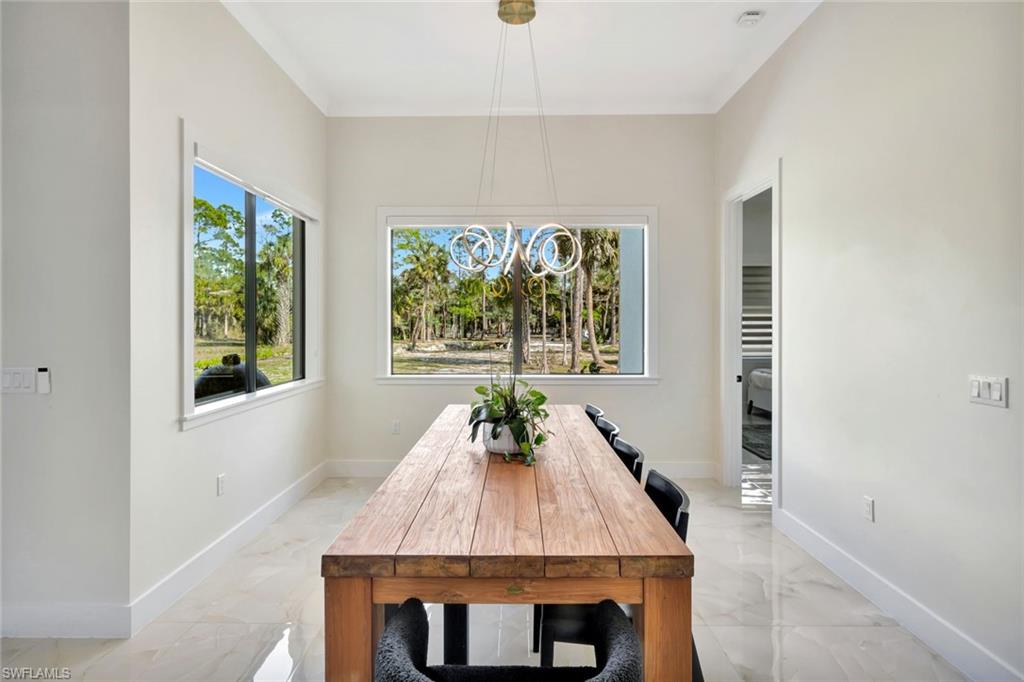 2546 4th Street Northwest Naples, FL 34120 - Photo 12 of 44 a dining room with window