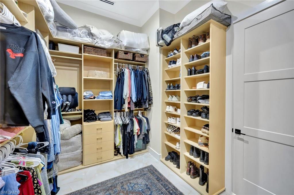 2546 4th Street Northwest Naples, FL 34120 - Photo 16 of 44 Walk in closet featuring light marble finish floors