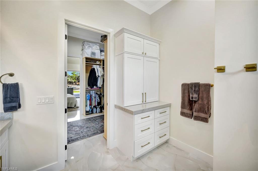2546 4th Street Northwest Naples, FL 34120 - Photo 18 of 44 Walk in closet with light marble finish floors