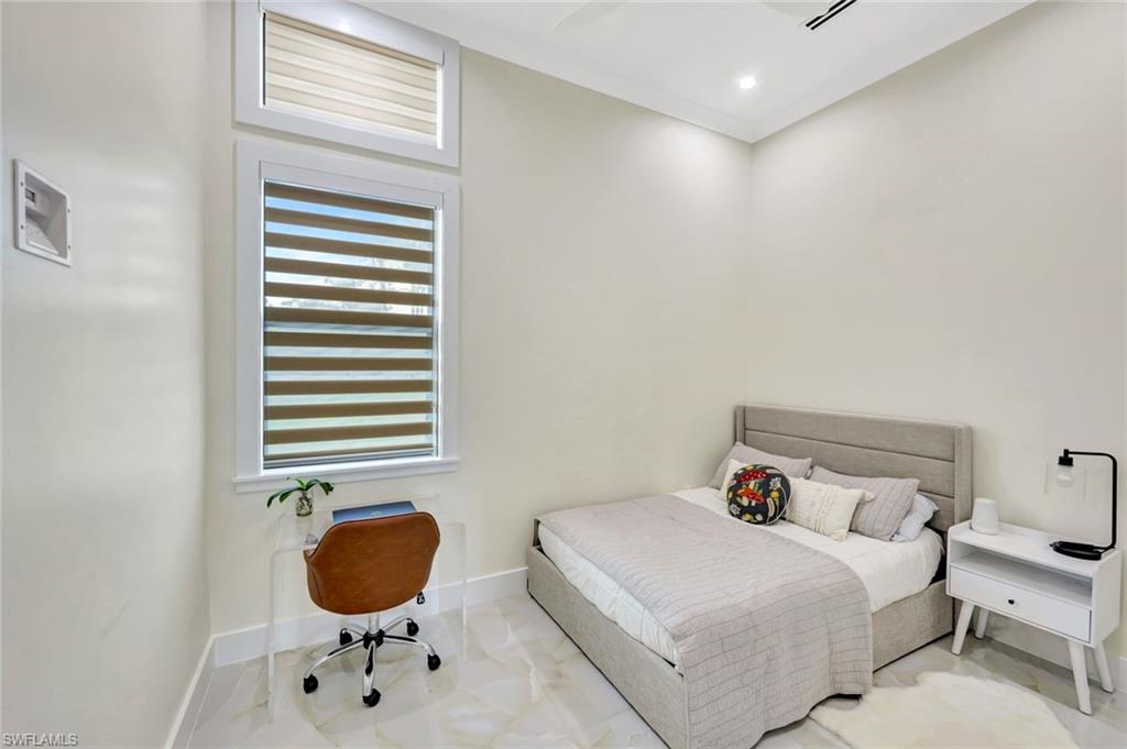 2546 4th Street Northwest Naples, FL 34120 - Photo 19 of 44 Bedroom with baseboards and a ceiling fan