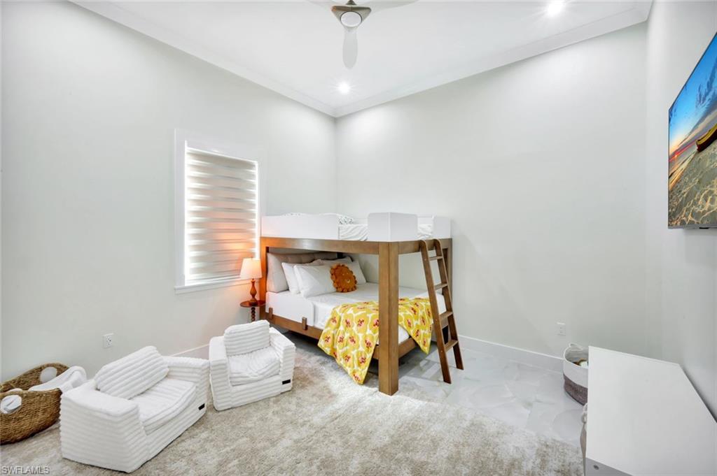 2546 4th Street Northwest Naples, FL 34120 - Photo 23 of 44 Bedroom with a ceiling fan and crown molding