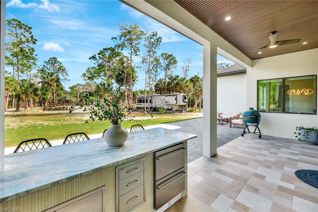 2546 4th Street Northwest Naples, FL 34120 - Photo 26 of 44 View of patio with area for grilling