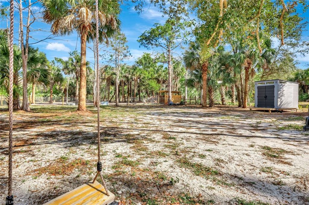 2546 4th Street Northwest Naples, FL 34120 - Photo 33 of 44 View of yard with a shed