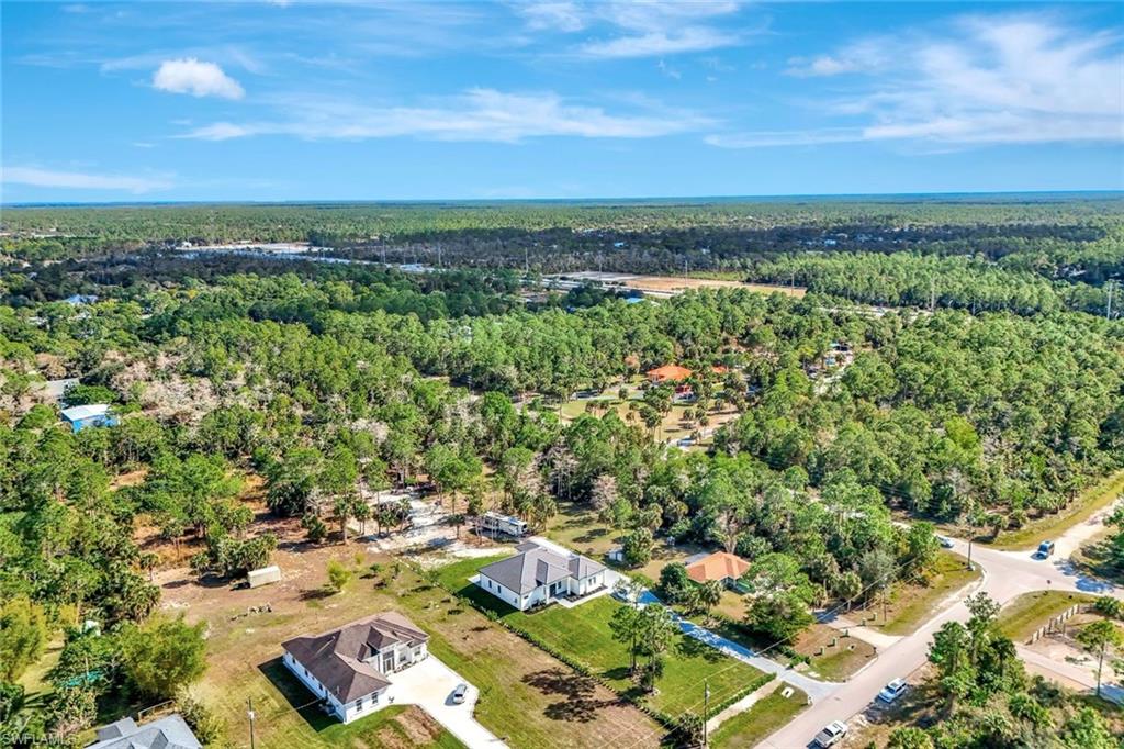 2546 4th Street Northwest Naples, FL 34120 - Photo 39 of 44 an aerial view of residential houses with outdoor space and trees