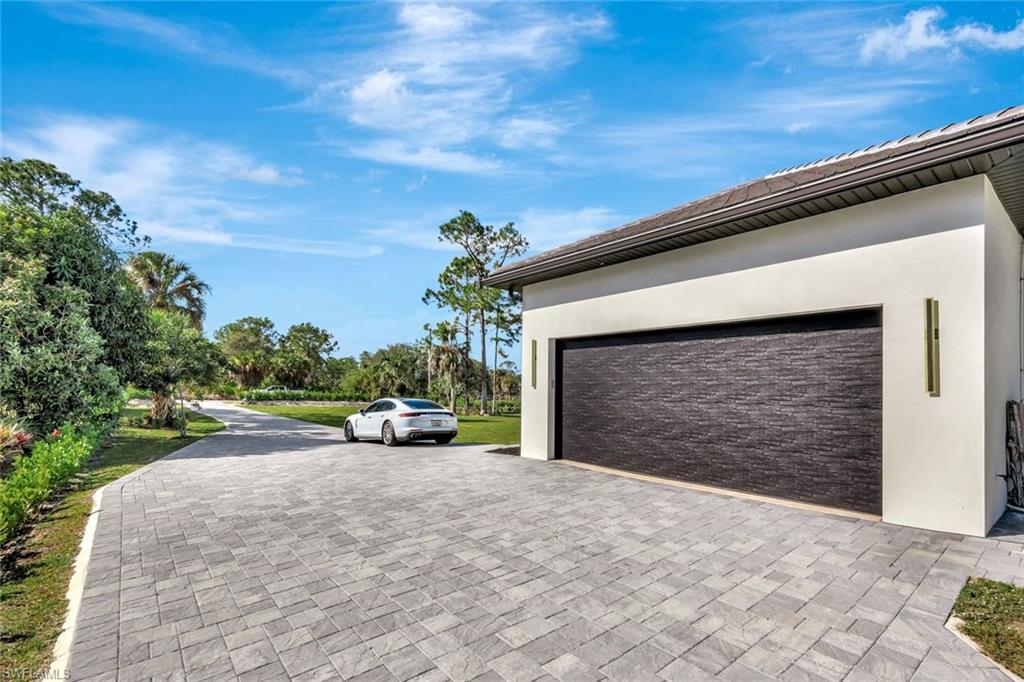 2546 4th Street Northwest Naples, FL 34120 - Photo 43 of 44 Garage with decorative driveway