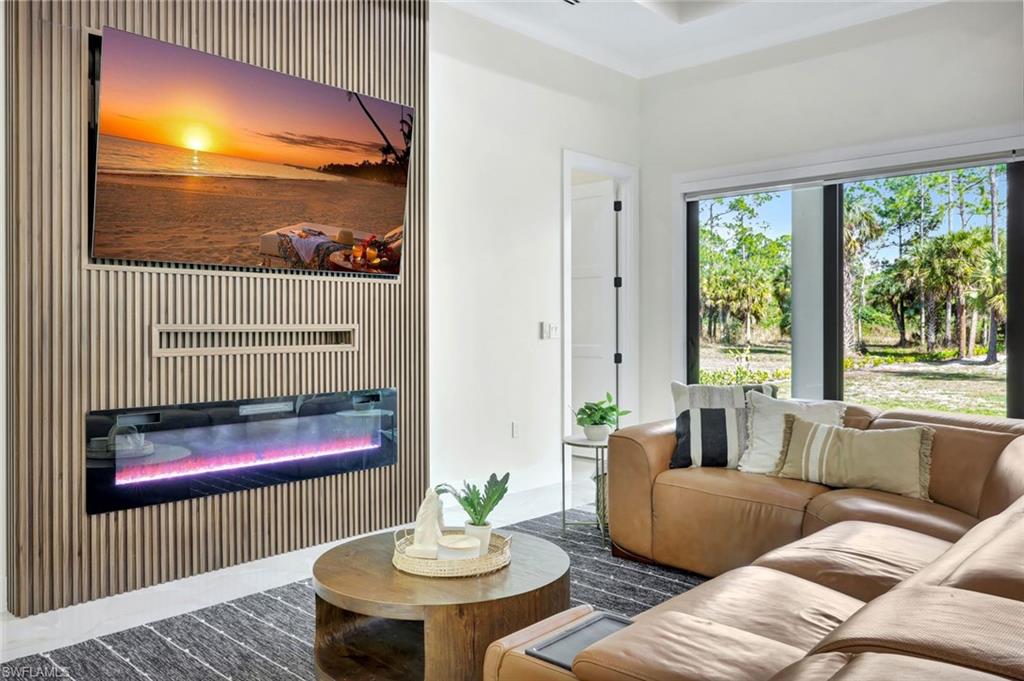 2546 4th Street Northwest Naples, FL 34120 - Photo 7 of 44 a living room with furniture and a window