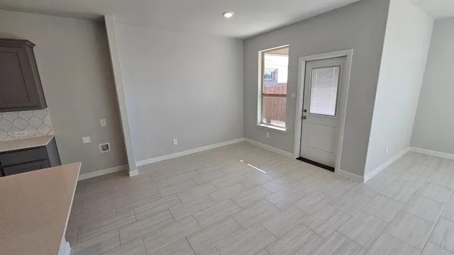 a kitchen with a sink a stove and refrigerator