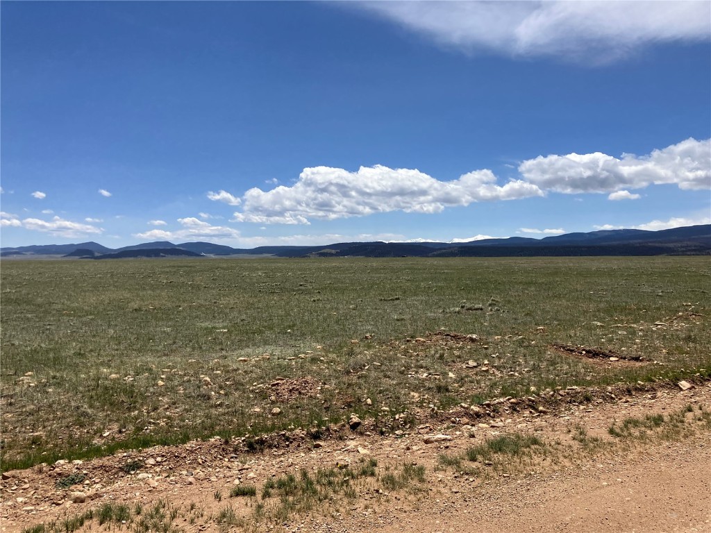 Property view of mountains with a rural view