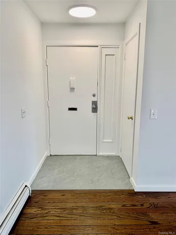 a view of room with hardwood floor