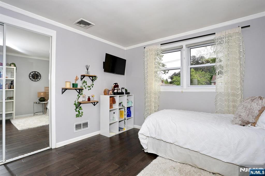 30 Brookfield Road Dumont, NJ 07628 - Photo 21 of 50 a bedroom with a bed and a window