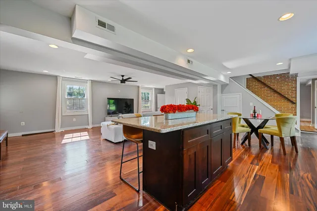 a open kitchen with a table and chairs