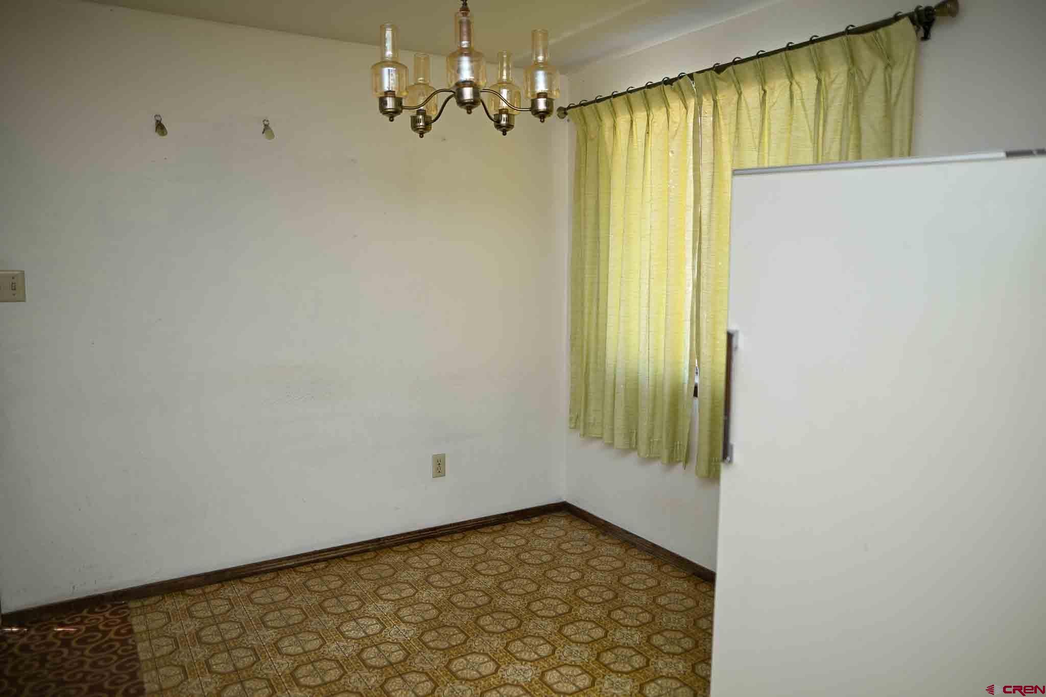 22120 Government Springs Road Montrose, CO 81403 - Photo 13 of 28 a view of a hallway with a window