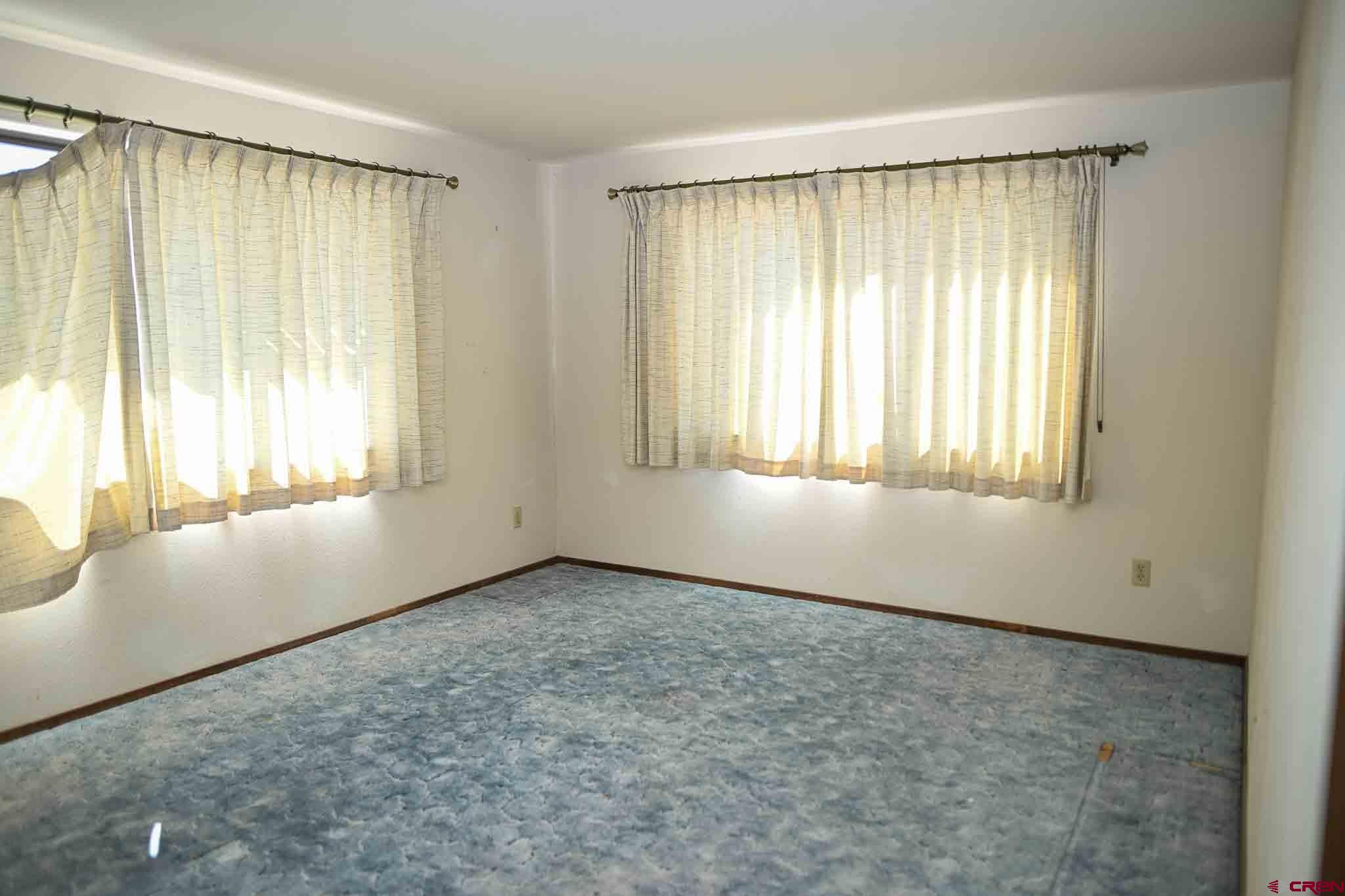 22120 Government Springs Road Montrose, CO 81403 - Photo 14 of 28 a view of an empty room with a window