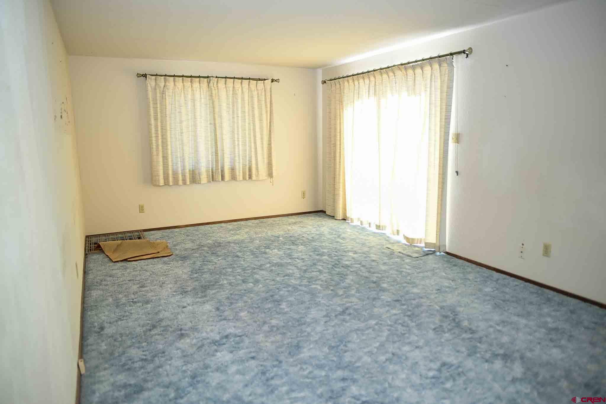 22120 Government Springs Road Montrose, CO 81403 - Photo 15 of 28 an empty room with windows