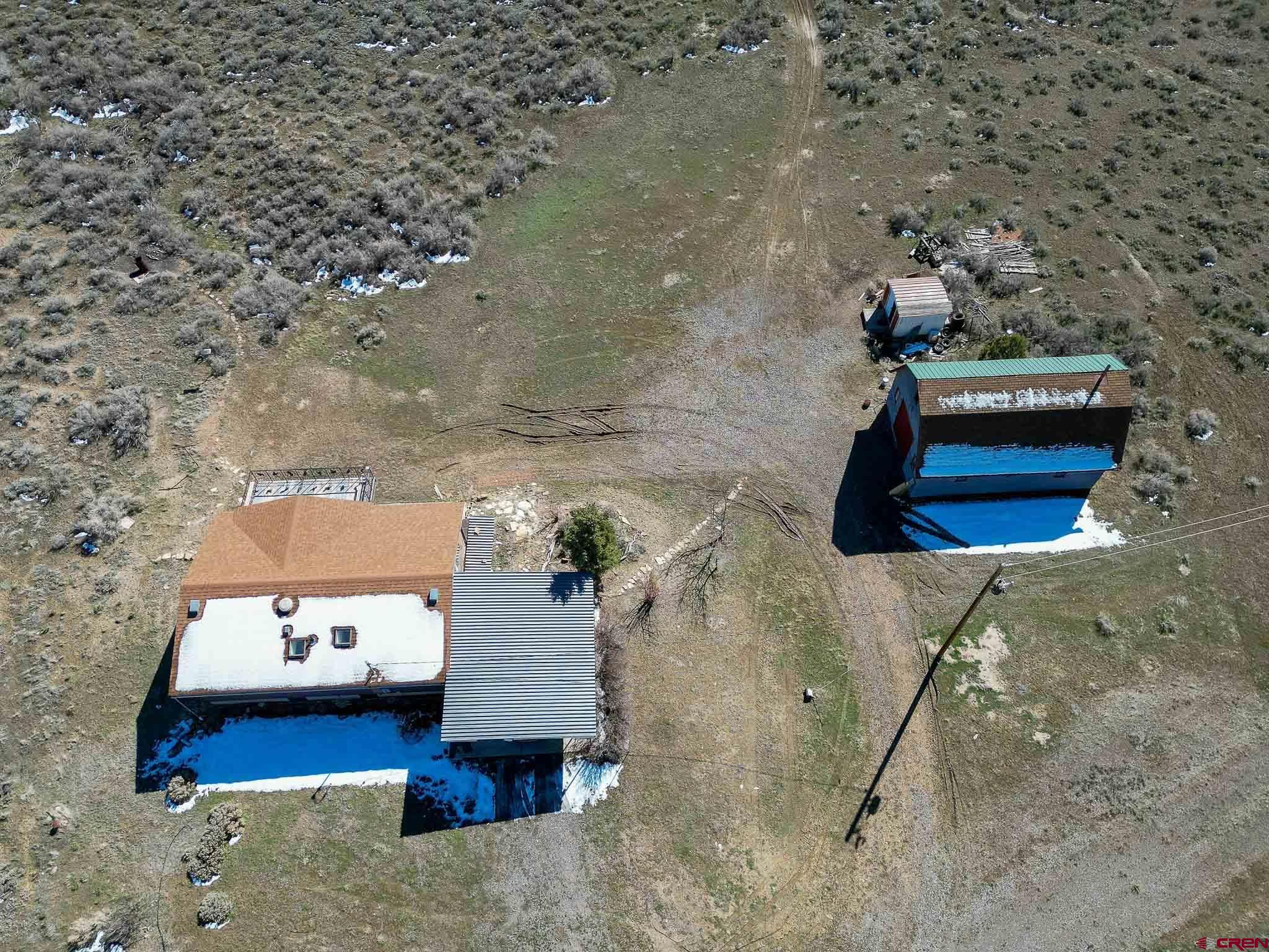 22120 Government Springs Road Montrose, CO 81403 - Photo 2 of 28 a living room with furniture