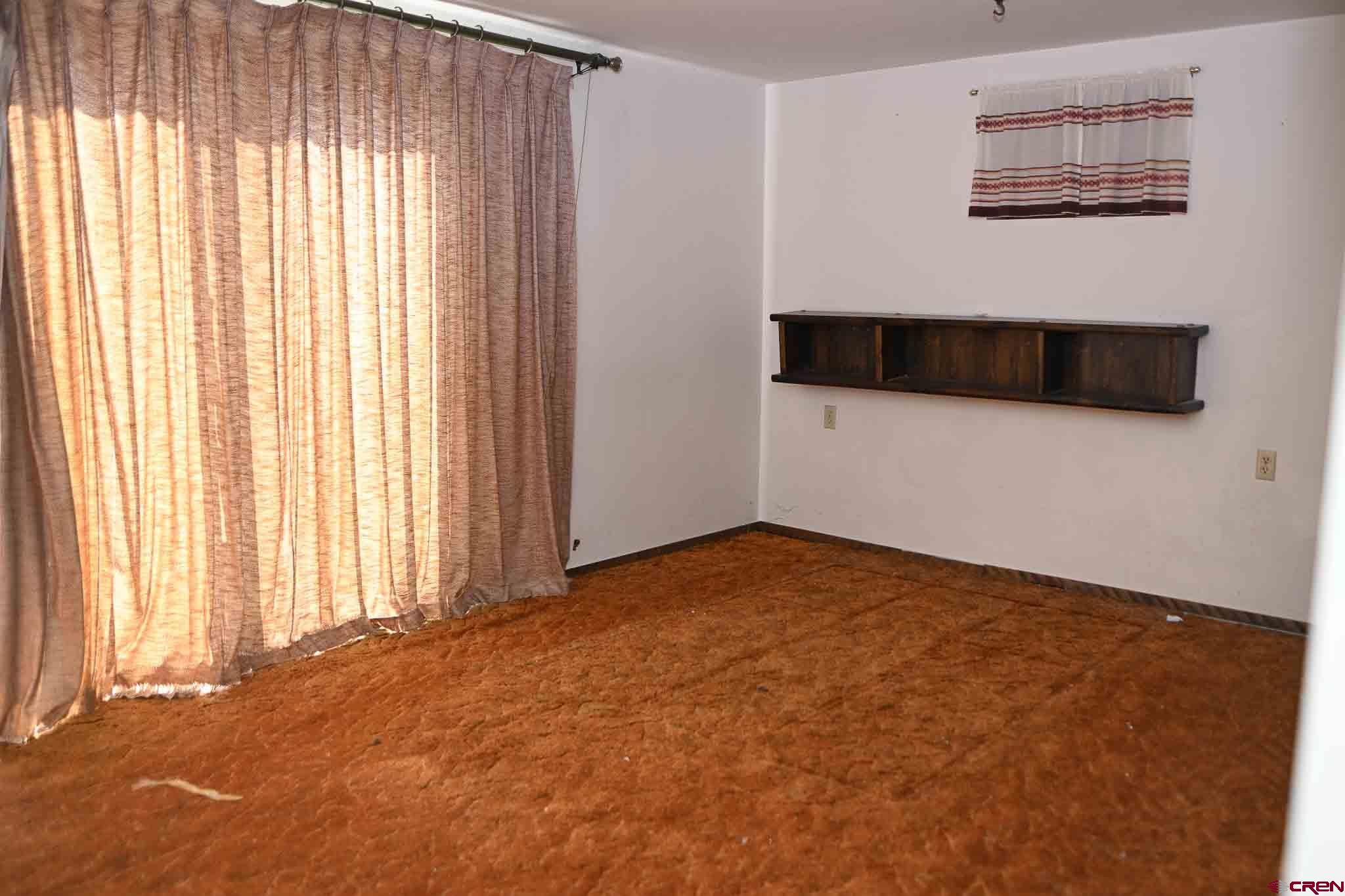 22120 Government Springs Road Montrose, CO 81403 - Photo 22 of 28 a view of an empty room with a window