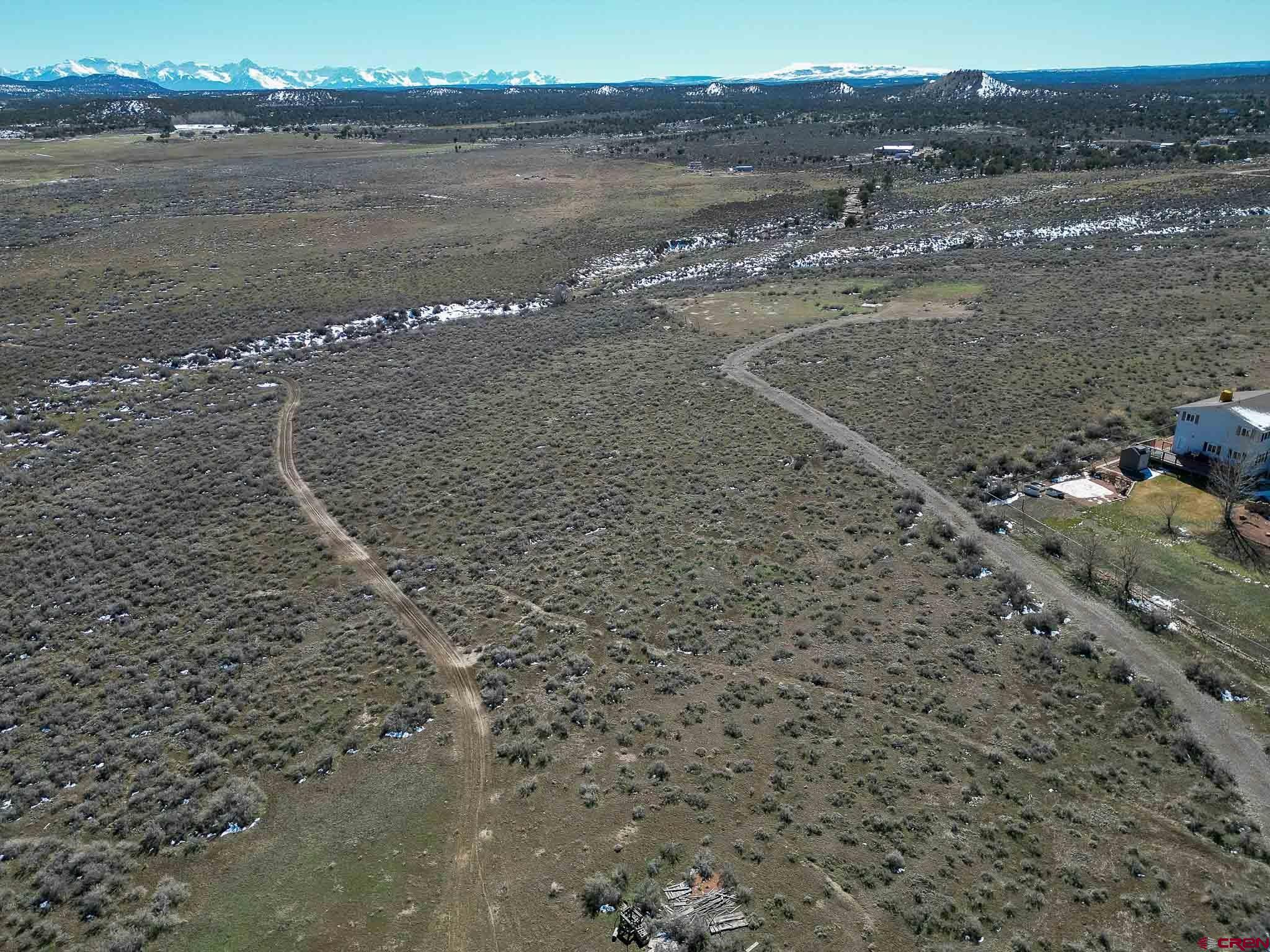 22120 Government Springs Road Montrose, CO 81403 - Photo 5 of 28 a view of a lake with beach and mountain view
