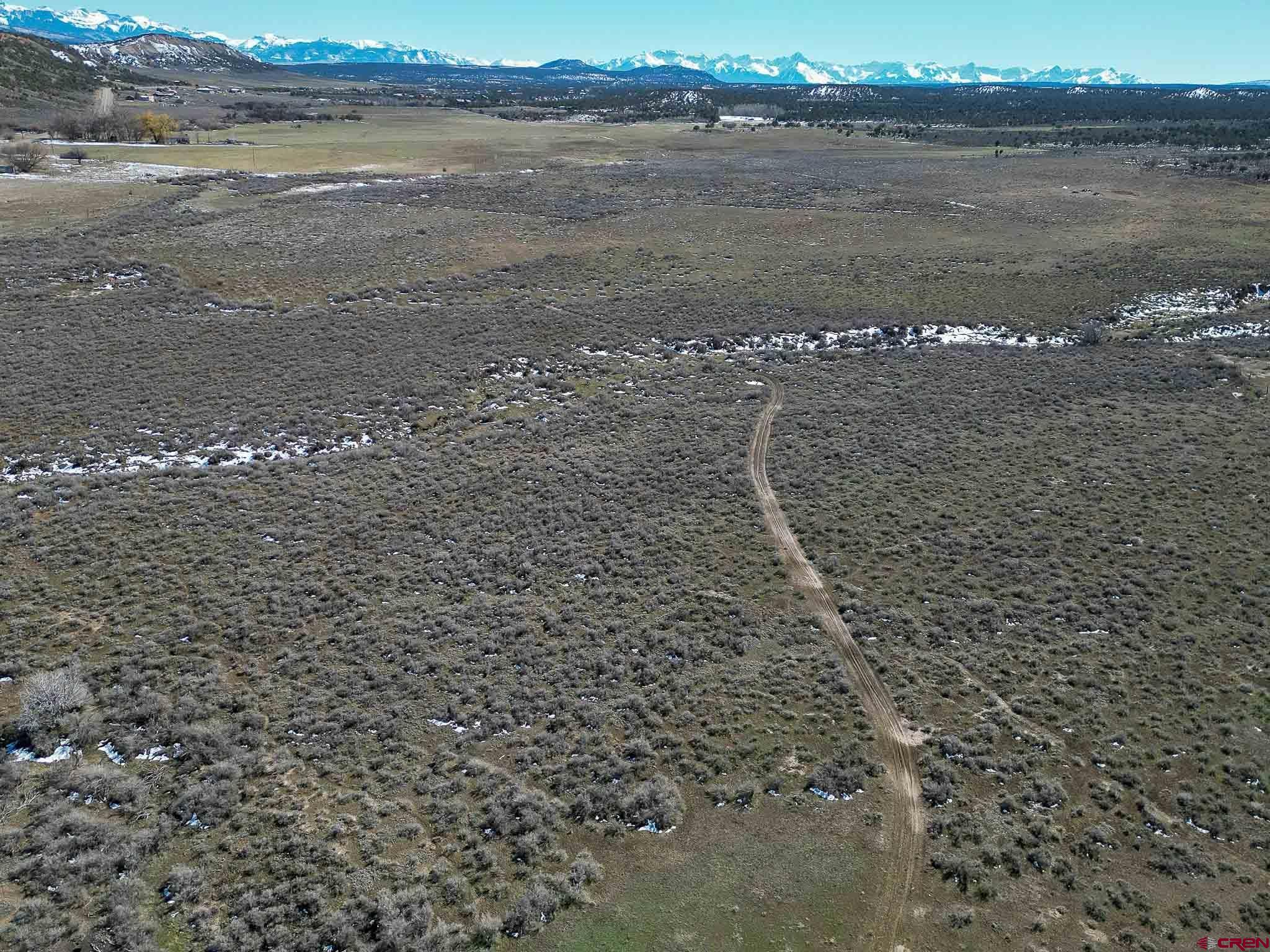 22120 Government Springs Road Montrose, CO 81403 - Photo 6 of 28 a view of a lake with beach and ocean view