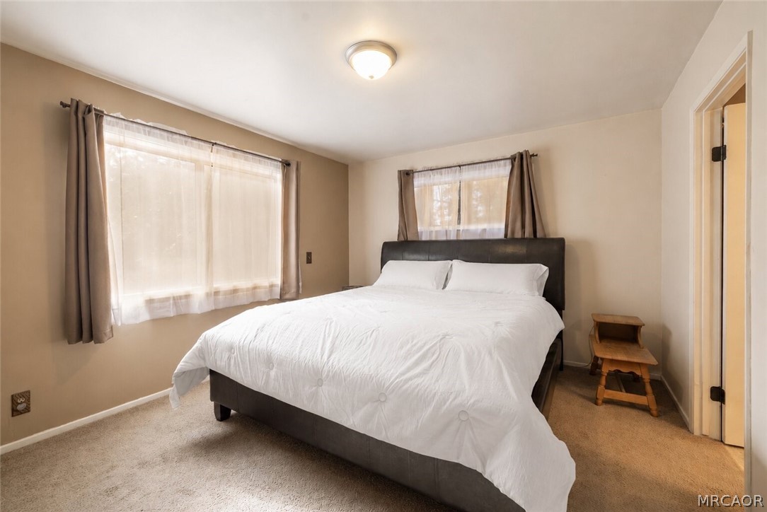 773 Sunset Lane Sugarloaf, CA 92386 - Photo 11 of 33 a bedroom with a bed and a window