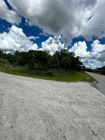 a view of a fountain in front of a house
