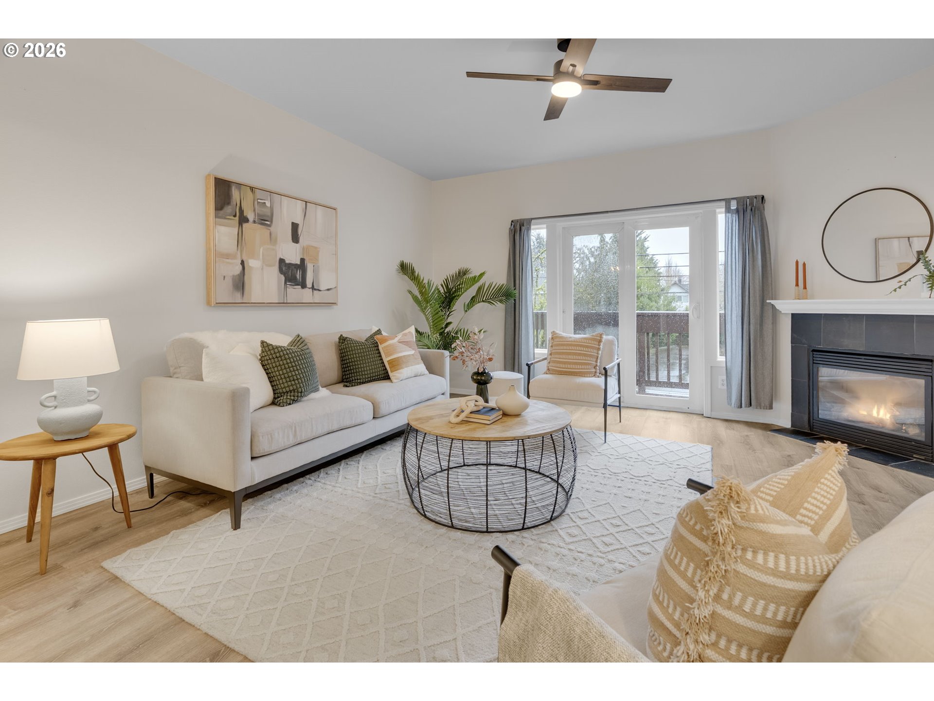 435 Northeast Cook Street Portland, OR 97212 - Photo 12 of 32 a living room with furniture potted plant and a fireplace