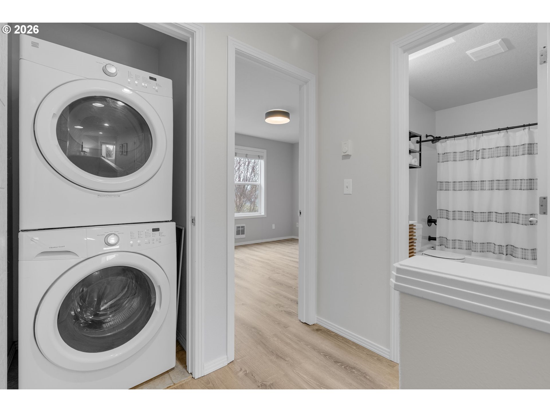 435 Northeast Cook Street Portland, OR 97212 - Photo 17 of 32 a view of a bathroom with washing machine and mirror