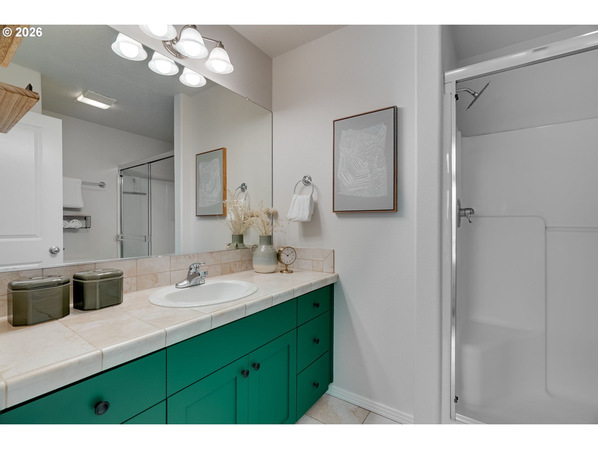 435 Northeast Cook Street Portland, OR 97212 - Photo 25 of 32 a bathroom with a double vanity sink and a mirror