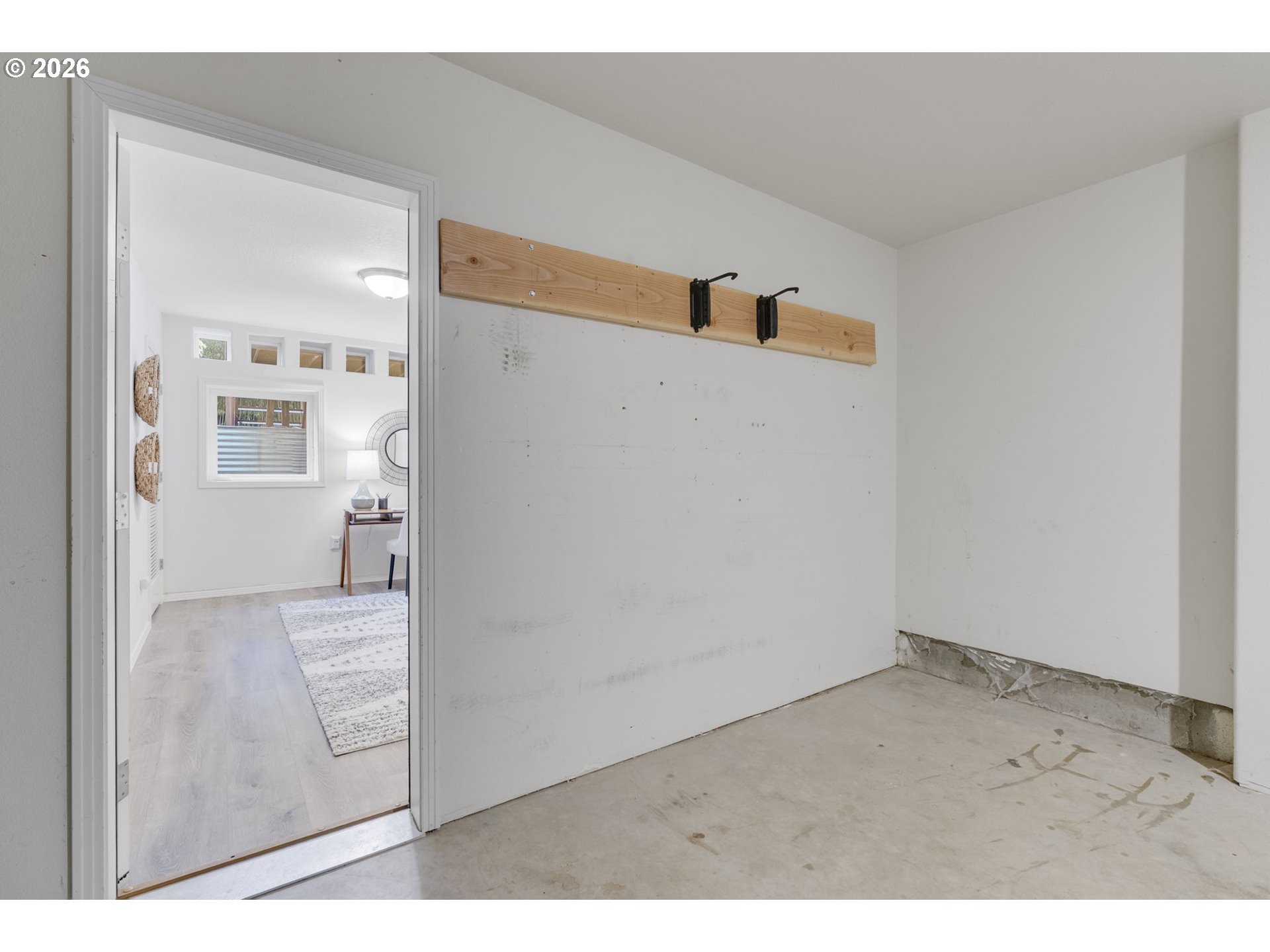 435 Northeast Cook Street Portland, OR 97212 - Photo 28 of 32 a view of a hallway with white walls and stairs