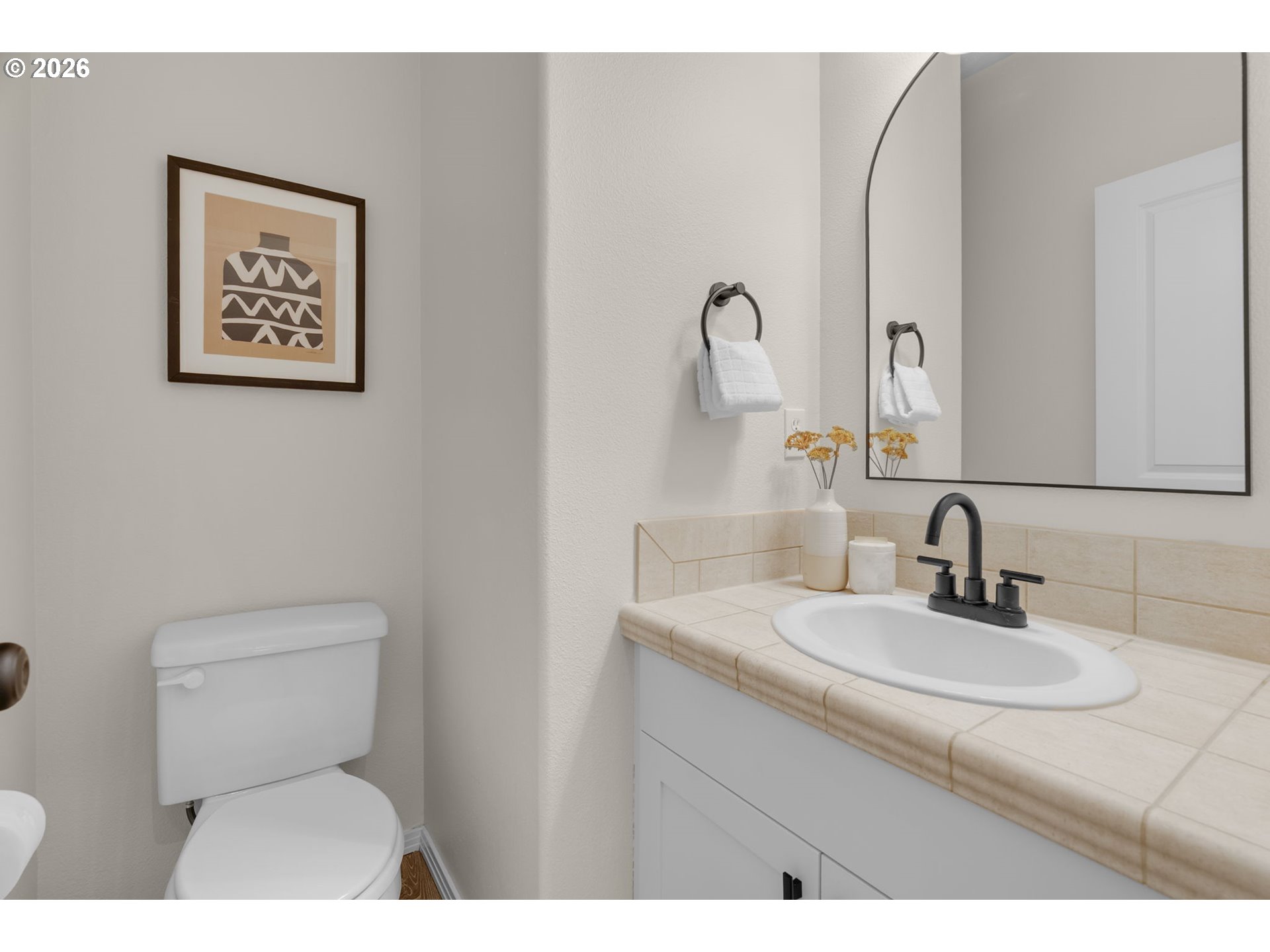 435 Northeast Cook Street Portland, OR 97212 - Photo 4 of 32 a bathroom with a toilet sink and mirror