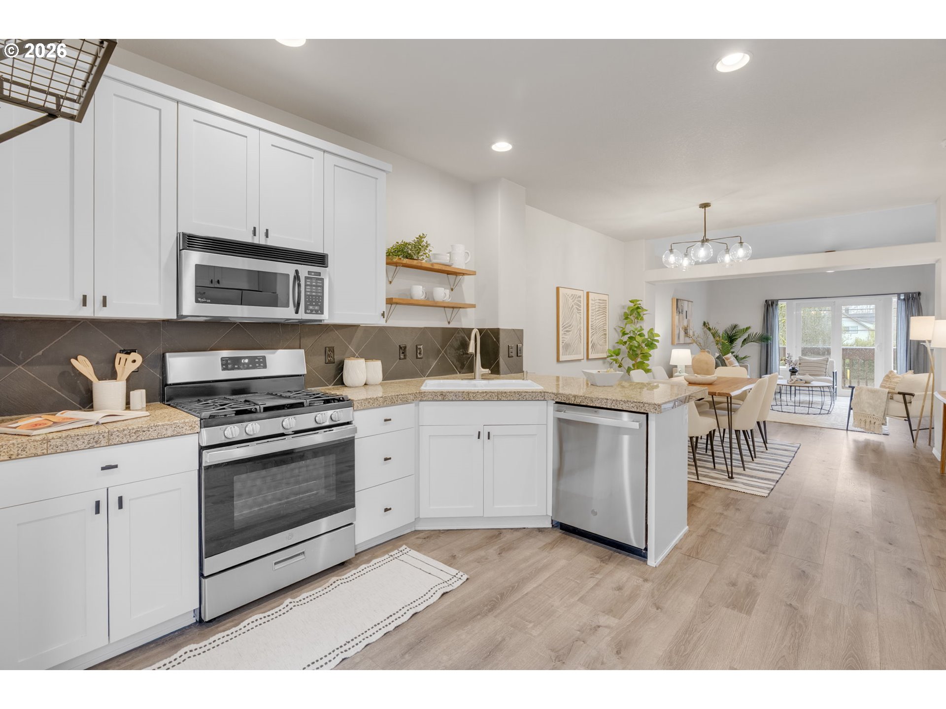 435 Northeast Cook Street Portland, OR 97212 - Photo 5 of 32 a kitchen with a stove and white cabinets