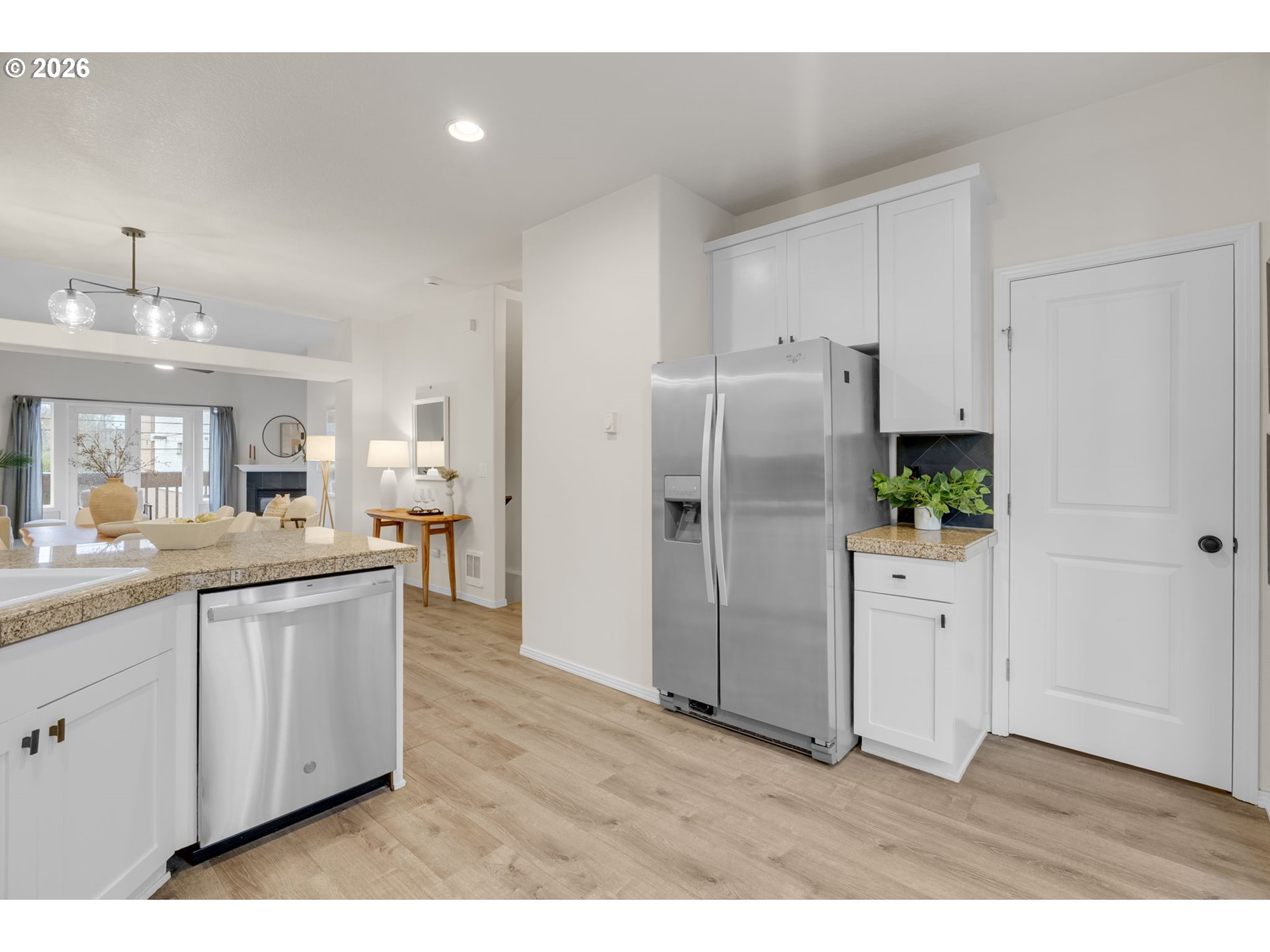 435 Northeast Cook Street Portland, OR 97212 - Photo 8 of 32 a kitchen with stainless steel appliances a refrigerator sink and cabinets