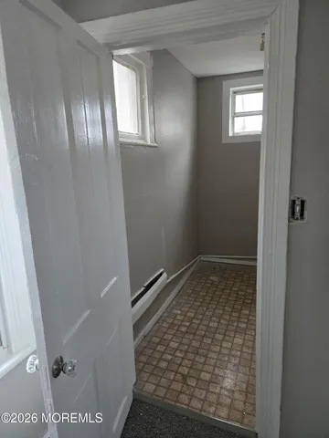 a bathroom with a glass door shower