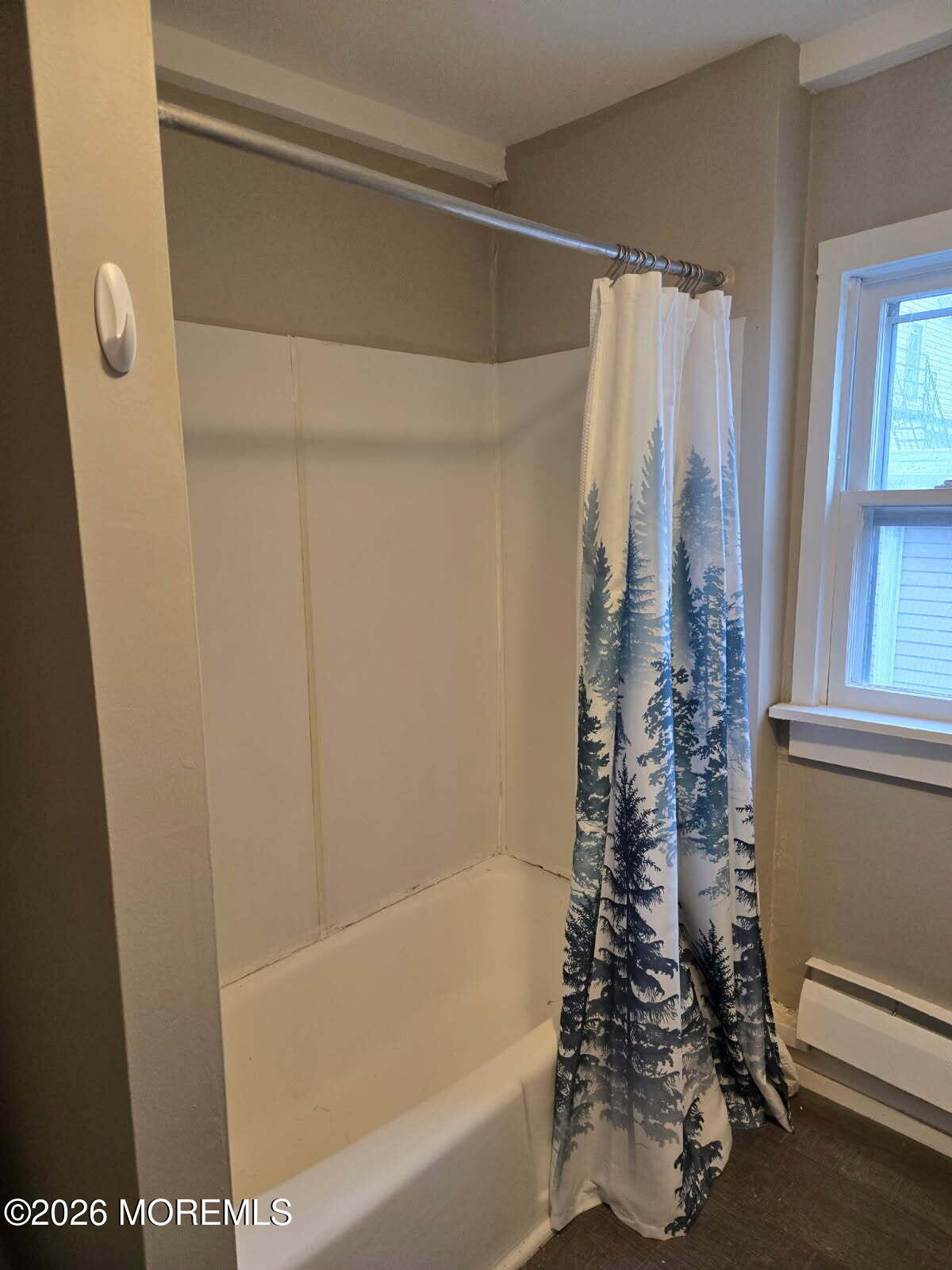 43 Webb Avenue, Unit C Ocean Grove, NJ 07756 - Photo 15 of 18 a bathroom with a shower curtain and a bathtub