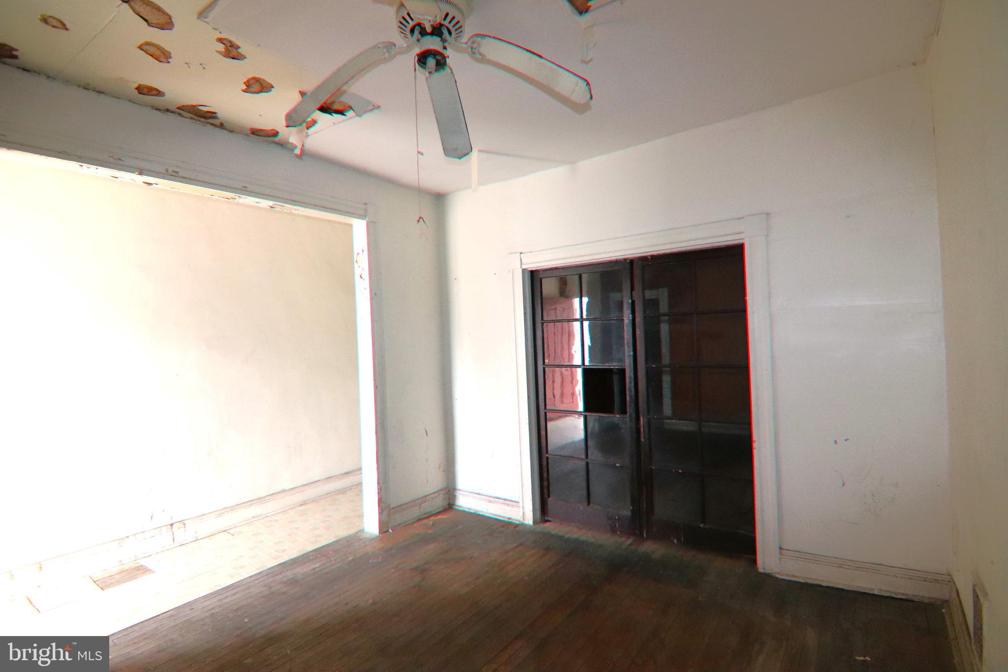 2317 Annapolis Road Baltimore, MD 21230 - Photo 11 of 14 a view of a livingroom with a ceiling fan and window