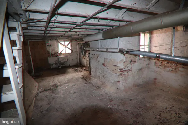 a view of a room with wooden walls