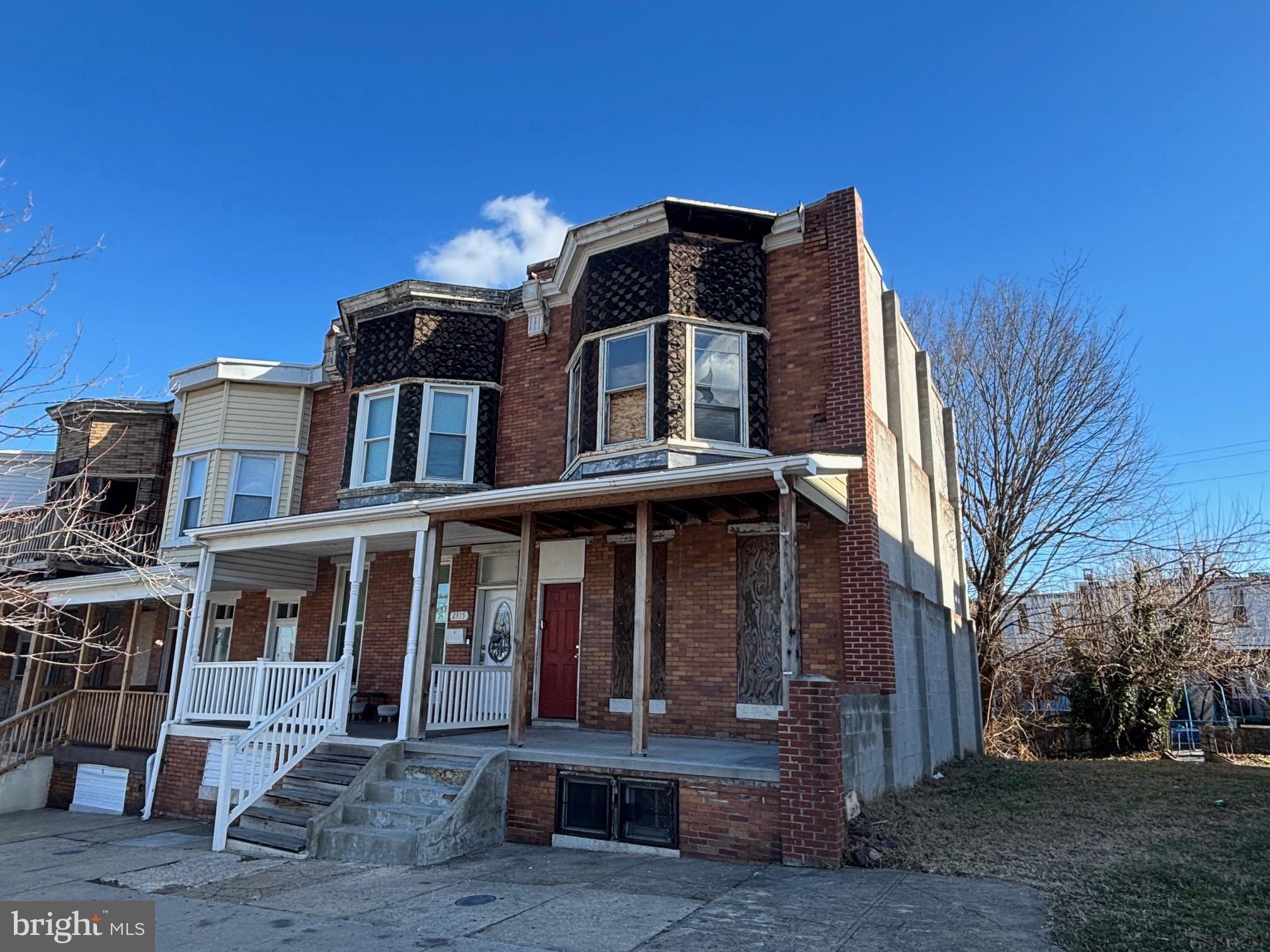 2317 Annapolis Road Baltimore, MD 21230 - Photo 2 of 14 a front view of a house with a yard