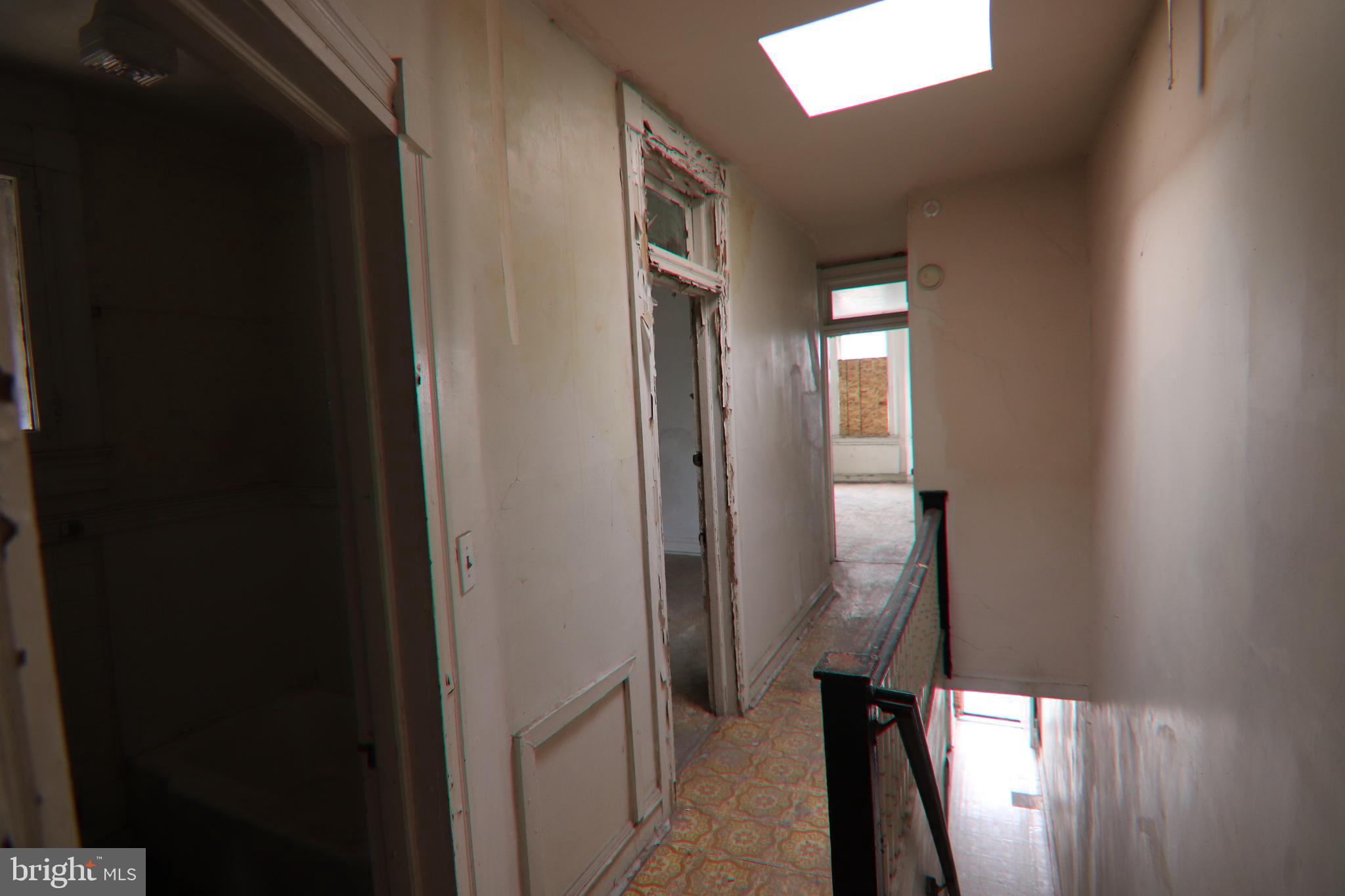 2317 Annapolis Road Baltimore, MD 21230 - Photo 9 of 14 a view of a hallway with wooden floor