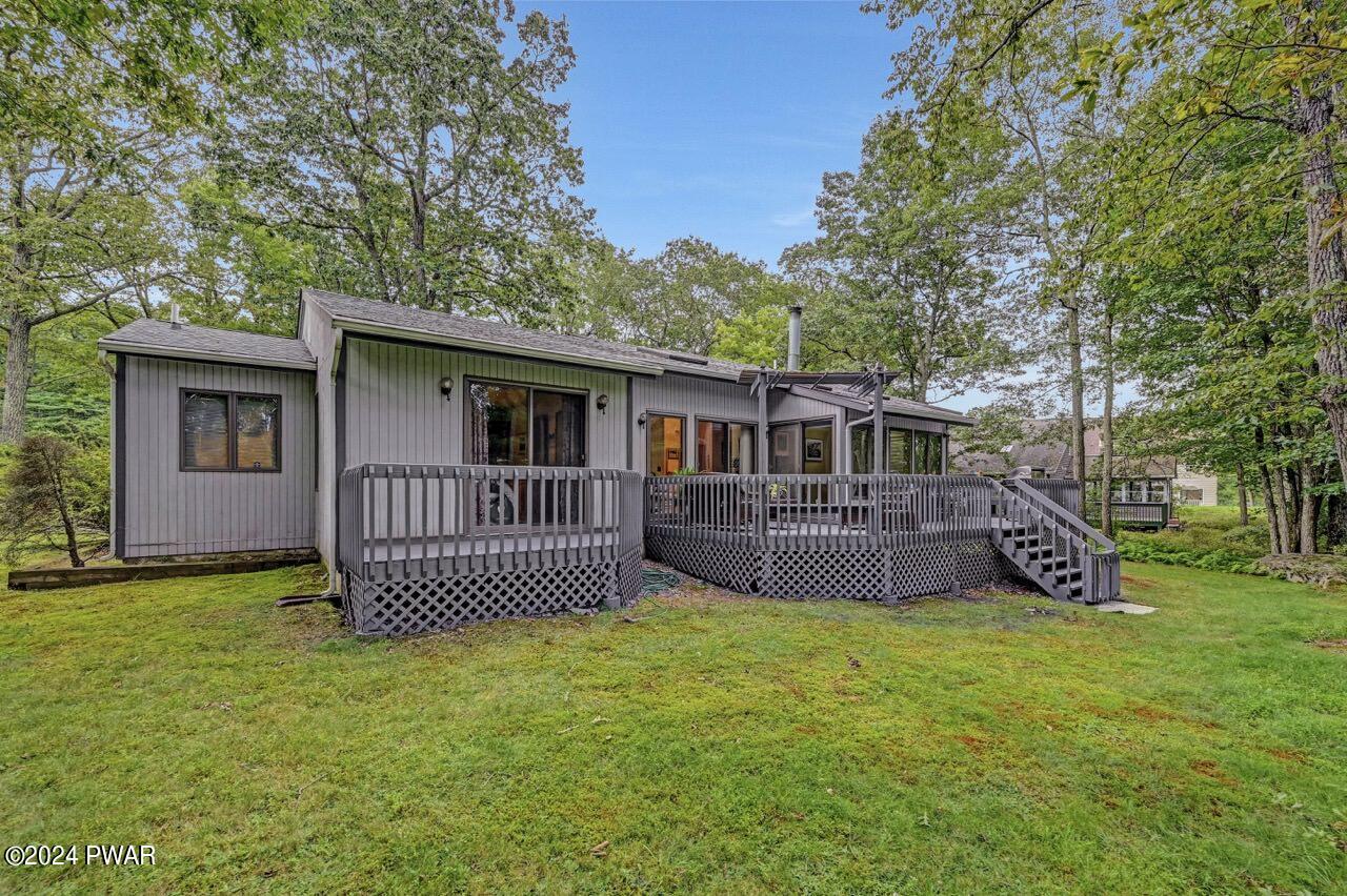 141 Maple Ridge Drive Hawley, PA 18428 - Photo 68 of 84 a view of a house with a yard and deck