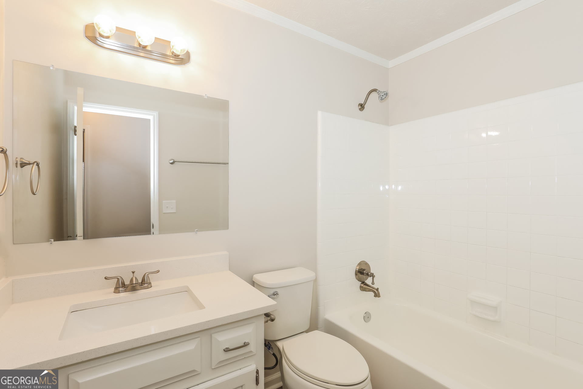 125 Whitney Way Fayetteville, GA 30214 - Photo 14 of 16 a bathroom with a sink vanity mirror and toilet